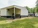 View of the home's exterior and backyard featuring a patio and outdoor space at 204 Wiley Oaks Dr, Wendell, NC 27591