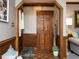 Foyer with wood trim, hardwood floors, and charming decor elements at 204 Wiley Oaks Dr, Wendell, NC 27591