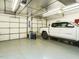 Bright garage interior with insulated doors and room for vehicle and storage at 204 Wiley Oaks Dr, Wendell, NC 27591