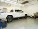 A well-lit garage interior features ample space for parking and storage solutions at 204 Wiley Oaks Dr, Wendell, NC 27591