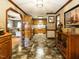 Traditional kitchen featuring oak cabinets, neutral countertop, and checkered flooring at 204 Wiley Oaks Dr, Wendell, NC 27591