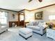 Cozy living room featuring neutral furniture, wood trim and large picture window at 204 Wiley Oaks Dr, Wendell, NC 27591