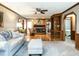 Bright living room featuring a fireplace, hardwood floors, and neutral furniture at 204 Wiley Oaks Dr, Wendell, NC 27591