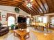 Open living area with wood beamed ceiling, hardwood floors and lots of windows at 204 Wiley Oaks Dr, Wendell, NC 27591