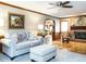 Comfortable living room with fireplace, hardwood floors, and stylish decor at 204 Wiley Oaks Dr, Wendell, NC 27591