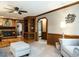Cozy living room with fireplace, built-in shelving, and comfortable seating at 204 Wiley Oaks Dr, Wendell, NC 27591