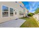 Backyard area showcasing a small concrete patio and lush green lawn at 205 Begen St, Morrisville, NC 27560