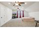 Spacious bedroom features vaulted ceilings, ceiling fans, and carpeted flooring at 205 Begen St, Morrisville, NC 27560