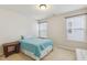 Bedroom featuring a bed with a blue blanket and two windows with blinds for natural light at 205 Begen St, Morrisville, NC 27560