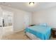 Bedroom featuring a bed with a blue blanket and an entrance to the adjacent room at 205 Begen St, Morrisville, NC 27560