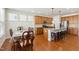Open floor plan featuring kitchen with island seating and dining area with natural light at 205 Begen St, Morrisville, NC 27560