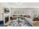 Spacious living room with a fireplace, neutral decor, and plenty of natural light at 205 Begen St, Morrisville, NC 27560