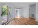 Bright bedroom with wood flooring, sliding glass doors and adjacent bathroom provides a relaxing retreat at 2123 Fountain Ridge Rd, Chapel Hill, NC 27517