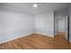 Serene bedroom with hardwood floors, ceiling fan, closet, and doorway, creating a relaxing atmosphere at 2123 Fountain Ridge Rd, Chapel Hill, NC 27517