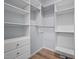 Organized walk-in closet with built-in shelving and drawers offers ample storage space at 2123 Fountain Ridge Rd, Chapel Hill, NC 27517