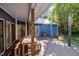 Covered deck with picnic table, grill and wooded backyard at 2123 Fountain Ridge Rd, Chapel Hill, NC 27517