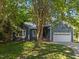 Exterior view of a well-maintained home with green lawn and mature trees at 2123 Fountain Ridge Rd, Chapel Hill, NC 27517