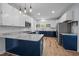Modern kitchen featuring two-tone cabinets, stainless steel appliances, and a marble-look countertop at 2123 Fountain Ridge Rd, Chapel Hill, NC 27517