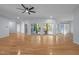 Open living room featuring hardwood floors, abundant natural light, and smooth access to other living areas at 2123 Fountain Ridge Rd, Chapel Hill, NC 27517