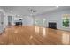 Expansive living area with hardwood floors, a cozy fireplace, and an open layout connecting to the kitchen at 2123 Fountain Ridge Rd, Chapel Hill, NC 27517