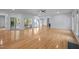 Bright and airy living room with hardwood floors, a fireplace, and seamless access to an outdoor patio at 2123 Fountain Ridge Rd, Chapel Hill, NC 27517
