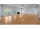 Large living room showcasing hardwood floors, natural lighting, and a traditional fireplace at 2123 Fountain Ridge Rd, Chapel Hill, NC 27517