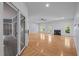Spacious living room featuring hardwood floors, a fireplace, and large windows for ample natural light at 2123 Fountain Ridge Rd, Chapel Hill, NC 27517