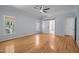 Spacious main bedroom with hardwood floors and a barn door leading to the en-suite bathroom at 2123 Fountain Ridge Rd, Chapel Hill, NC 27517