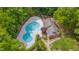 Aerial view of pool area with a clubhouse in a community surrounded by lush trees at 225 Bay Dr, Cary, NC 27511
