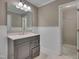 Bathroom features a vanity, updated fixtures, large mirror, and shower at 225 Bay Dr, Cary, NC 27511