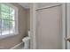 Bathroom features a toilet, shower, and a window for natural light at 225 Bay Dr, Cary, NC 27511