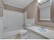 Well-lit bathroom with a vanity, a mirror, and a bathtub with a shower at 225 Bay Dr, Cary, NC 27511