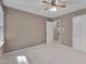 Neutral carpeted bedroom with two doors, one leading to another room or closet space at 225 Bay Dr, Cary, NC 27511