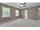 Spacious bedroom with a ceiling fan and two windows for natural light at 225 Bay Dr, Cary, NC 27511