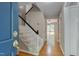 Bright foyer with hardwood floors, a carpeted staircase, and views into adjacent living spaces at 225 Bay Dr, Cary, NC 27511