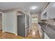 Bright kitchen featuring stainless steel appliances, granite countertops, white cabinets, and hardwood flooring at 225 Bay Dr, Cary, NC 27511