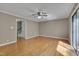 Spacious living room with hardwood floors and access to a deck through a sliding glass door at 225 Bay Dr, Cary, NC 27511