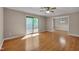 Spacious living room with hardwood floors and access to a deck through a sliding glass door at 225 Bay Dr, Cary, NC 27511