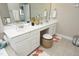 Bathroom vanity featuring dual sinks, lots of counter space, and storage at 2318 Carriage Oaks Dr, Raleigh, NC 27614