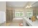 Elegant bathroom with a soaking tub, separate shower, and dual vanity at 2318 Carriage Oaks Dr, Raleigh, NC 27614