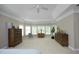 Bright bedroom with tray ceilings, neutral tones, and lots of natural light at 2318 Carriage Oaks Dr, Raleigh, NC 27614