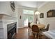 Cozy breakfast nook featuring a fireplace and access to a patio at 2318 Carriage Oaks Dr, Raleigh, NC 27614