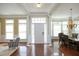 Elegant entryway featuring hardwood floors, natural light, and classic architectural columns at 2318 Carriage Oaks Dr, Raleigh, NC 27614