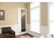 Cozy living room with a view of the doorway, plenty of natural light from the windows, and decor at 2318 Carriage Oaks Dr, Raleigh, NC 27614