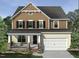 Charming two-story home with a covered front porch, stone accents and attached garage in a Gathering-friendly neighborhood at 2380 Picual Way # 28, New Hill, NC 27562