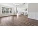 Spacious living area with luxury vinyl plank flooring and an open layout to the kitchen at 2434 Barreto Dr, Wendell, NC 27591