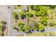Birds-eye view of house featuring mature trees, spacious yard, and convenient access to adjacent roadways at 2500 Courtland Dr, Sanford, NC 27330