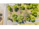 Aerial view of a home featuring mature trees, spacious yard, and a convenient corner lot location at 2500 Courtland Dr, Sanford, NC 27330