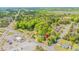 Overhead view of a residential area showcasing the home's location, mature trees and community features at 2500 Courtland Dr, Sanford, NC 27330