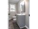 Bathroom with a gray vanity and updated fixtures at 2500 Courtland Dr, Sanford, NC 27330